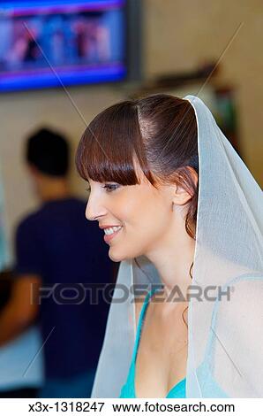Woman bride fixing wedding veil View Large Photo Image Stock Photo - Woman bride fixing wedding veil. Fotosearch