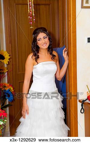 Woman bride wearing wedding dress View Large Photo Image Stock Photo - Woman bride wearing wedding dress. Fotosearch
