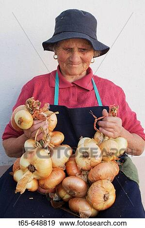 Woman bundling onions, Palas de Rei. Lugo province, Galicia, Spain View Large Photo Image Stock Photo - Woman bundling onions, Palas de Rei. Lugo province, Galicia, Spain. Fotosearch