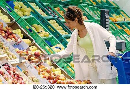 Woman buying fruit View Large Photo Image Stock Image - Woman buying fruit. Fotosearch