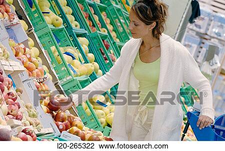 Woman buying fruit View Large Photo Image Stock Image - Woman buying fruit. Fotosearch