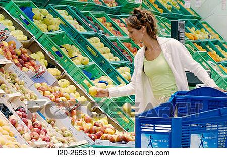 Woman buying fruit View Large Photo Image Stock Photo - Woman buying fruit. Fotosearch