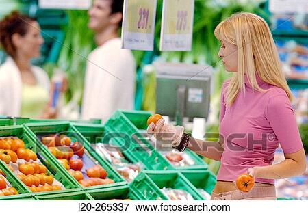 Woman buying fruit View Large Photo Image Stock Photo - Woman buying fruit. Fotosearch
