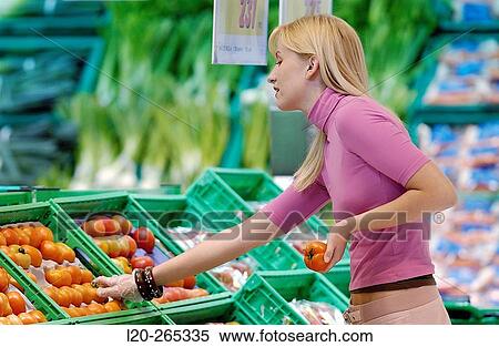 Woman buying fruit View Large Photo Image Stock Photography - Woman buying fruit. Fotosearch