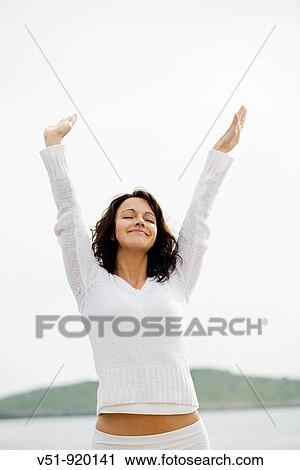 Woman by the sea breathing fresh air View Large Photo Image Stock Image - Woman by the sea breathing fresh air. Fotosearch