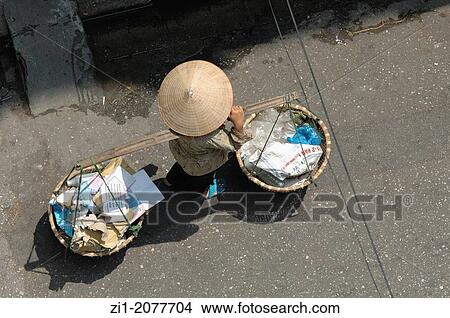 woman carriying baskets in Hanoi, Vietnam View Large Photo Image Picture - woman carriying baskets in Hanoi, Vietnam. Fotosearch