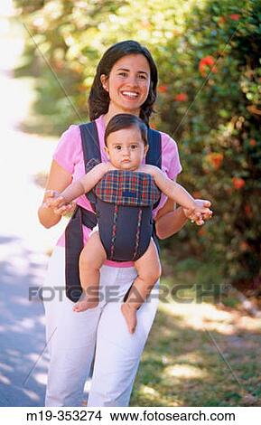 woman carrying her baby View Large Photo Image Picture - woman carrying her baby. Fotosearch