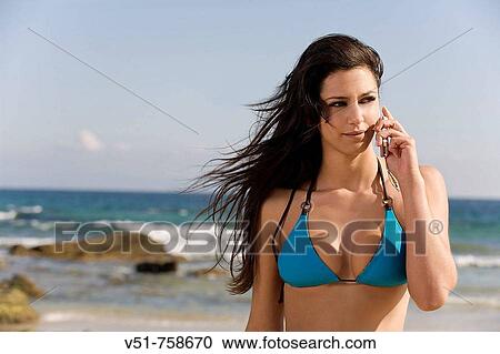 woman, cell phone, beach, 20-30 years old View Large Photo Image Stock Image - woman, cell phone, beach, 20-30 years old. Fotosearch