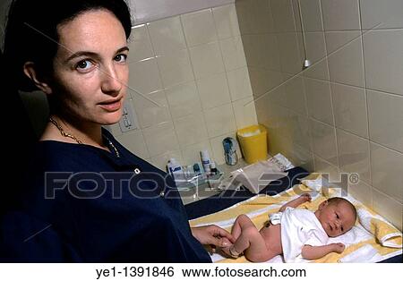 Woman changing the nappy of her three days old baby View Large Photo Image Stock Photograph - Woman changing the nappy of her three days old baby. Fotosearch