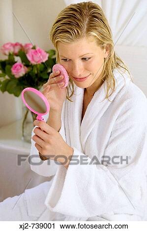 Woman cleaning her face View Large Photo Image Stock Image - Woman cleaning her face. Fotosearch