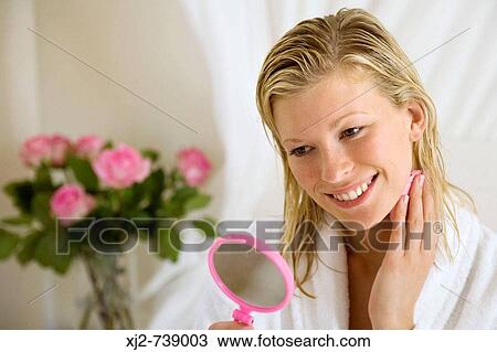 Woman cleaning her face View Large Photo Image Stock Image - Woman cleaning her face. Fotosearch