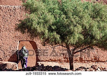 Woman coming in a Kasbah, Zagora, Draa Valley, Morocco View Large Photo Image Stock Photography - Woman coming in a Kasbah, Zagora, Draa Valley, Morocco. Fotosearch