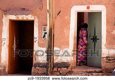 Woman coming in her house in the mellah (jewish neighborhood). Ouarzazate, Morocco View Large Photo Image Stock Photo - Woman coming in her house in the mellah (jewish neighborhood). Ouarzazate, Morocco. Fotosearch