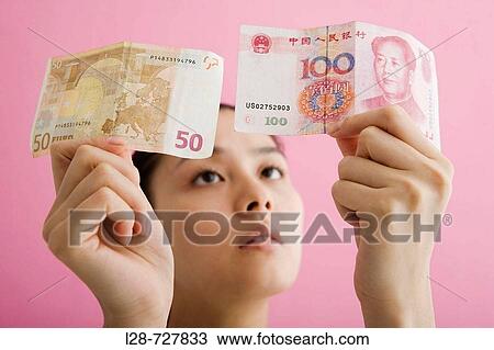 Woman Compare Euro Banknote with yuan Banknote View Large Photo Image Stock Image - Woman Compare Euro Banknote with yuan Banknote. Fotosearch