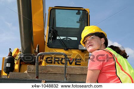 Woman construction worker on a job site View Large Photo Image Stock Image - Woman construction worker on a job site. Fotosearch