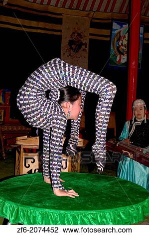 Woman Contortionist Performing on a Table in Ulaan Baatar Mongolia. View Large Photo Image Stock Image - Woman Contortionist Performing on a Table in Ulaan Baatar Mongolia.. Fotosearch