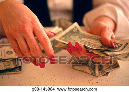 Woman counting money View Large Photo Image Picture - Woman counting money. Fotosearch