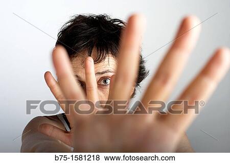 Woman covering camera with her hands View Large Photo Image Stock Photo - Woman covering camera with her hands. Fotosearch