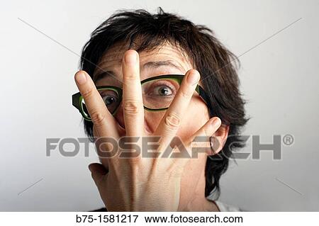 Woman covering her face View Large Photo Image Stock Photo - Woman covering her face. Fotosearch