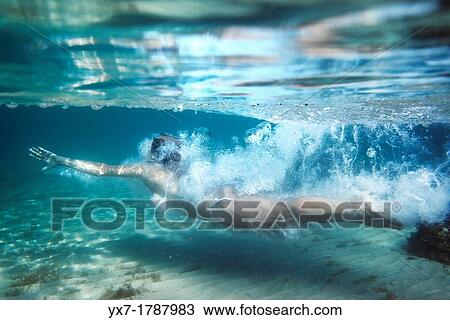 Woman diving underwater. View Large Photo Image Stock Image - Woman diving underwater.. Fotosearch