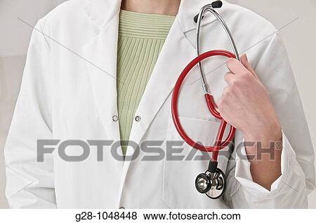 woman doctor with red stethoscope head invisible View Large Photo Image Stock Photo - woman doctor with red stethoscope head invisible. Fotosearch