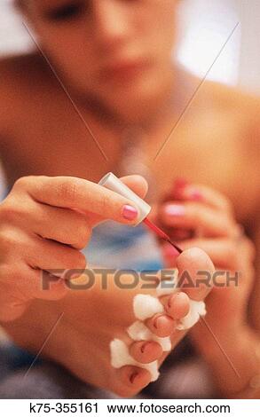 Stock Image - woman doing a pedicure. Fotosearch