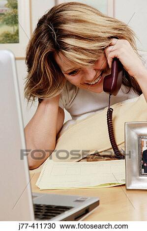 Woman doing business on phone. View Large Photo Image Stock Image - Woman doing business on phone.. Fotosearch