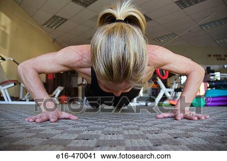 Woman doing exercises View Large Photo Image Stock Image - Woman doing exercises. Fotosearch
