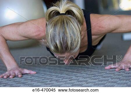 Woman doing pushups View Large Photo Image Stock Photography - Woman doing pushups. Fotosearch