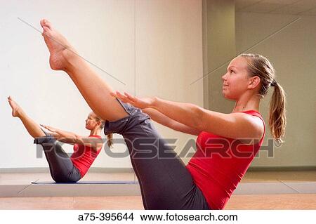 woman doing the teaser, a pilates exercise View Large Photo Image Picture - woman doing the teaser, a pilates exercise. Fotosearch