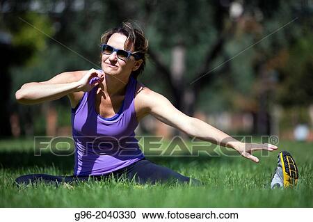 Woman doing workout outdoors. View Large Photo Image Stock Image - Woman doing workout outdoors.. Fotosearch
