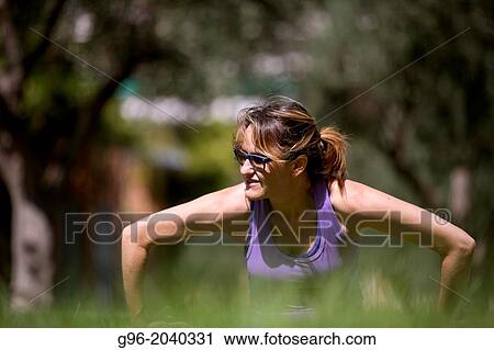Woman doing workout outdoors. View Large Photo Image Stock Image - Woman doing workout outdoors.. Fotosearch