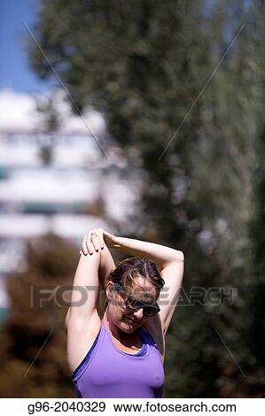 Woman doing workout outdoors. View Large Photo Image Stock Photo - Woman doing workout outdoors.. Fotosearch