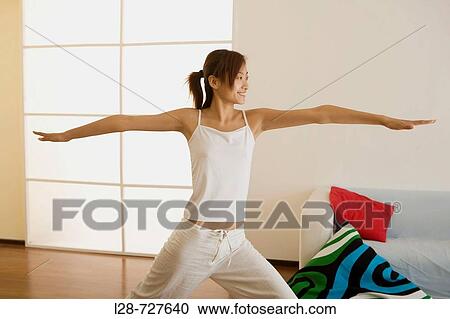 Woman doing yoga at Home View Large Photo Image Stock Image - Woman doing yoga at Home. Fotosearch