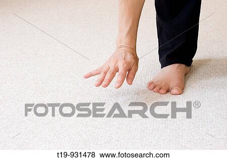 Stock Photo - Woman doing yoga in a studio MR. Fotosearch