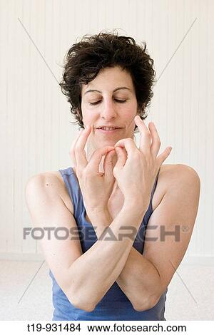 Picture - Woman doing yoga in a studio Pose:? mudra? MR. Fotosearch