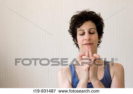 Woman doing yoga in a studio Pose:? Devi mudra? MR View Large Photo Image Stock Photo - Woman doing yoga in a studio Pose:? Devi mudra? MR. Fotosearch
