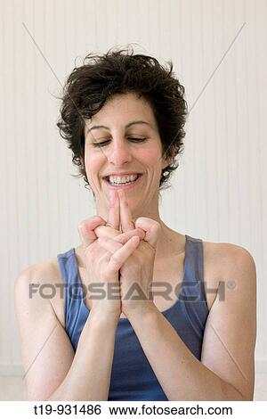 Woman doing yoga in a studio Pose:? mudra? MR View Large Photo Image Stock Photograph - Woman doing yoga in a studio Pose:? mudra? MR. Fotosearch