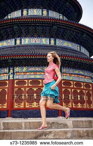 Stock Photography - Woman downstairs in the Temple of Heaven. Beijing. China.. Fotosearch