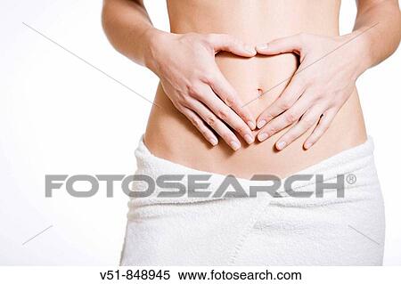 Woman drawing a heart in her belly View Large Photo Image Stock Photography - Woman drawing a heart in her belly. Fotosearch