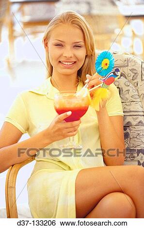 Woman drinking cocktail View Large Photo Image Stock Photograph - Woman drinking cocktail. Fotosearch