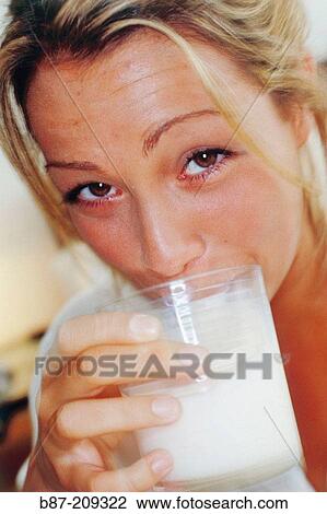 Woman drinking milk View Large Photo Image Stock Image - Woman drinking milk. Fotosearch