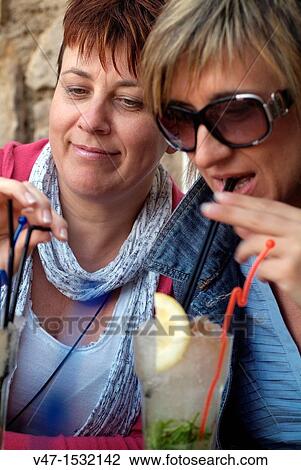 Woman drinking mojito, Benidorm, Costa Blanca, Alicante View Large Photo Image Stock Image - Woman drinking mojito, Benidorm, Costa Blanca, Alicante. Fotosearch