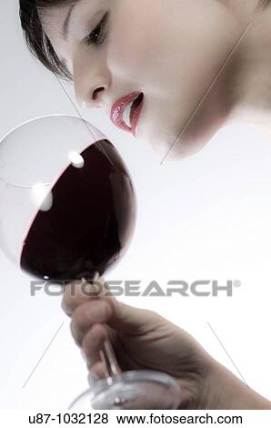 Woman drinking red wine View Large Photo Image Stock Photo - Woman drinking red wine. Fotosearch