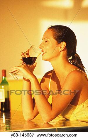 Stock Photo - Woman drinking red wine. Fotosearch