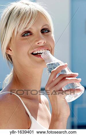 Stock Image - woman drinking. Fotosearch