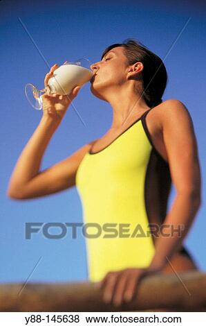 Woman drinking View Large Photo Image Stock Photo - Woman drinking. Fotosearch
