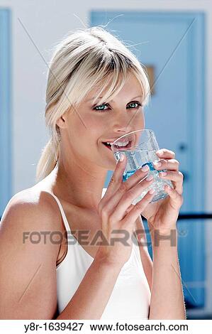 Stock Photo - woman drinking. Fotosearch