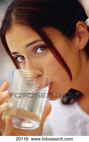 Woman drinking water View Large Photo Image Stock Photograph - Woman drinking water. Fotosearch