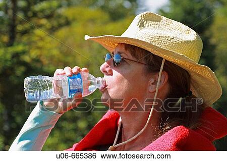 Stock Photograph - Woman drinking water. Fotosearch